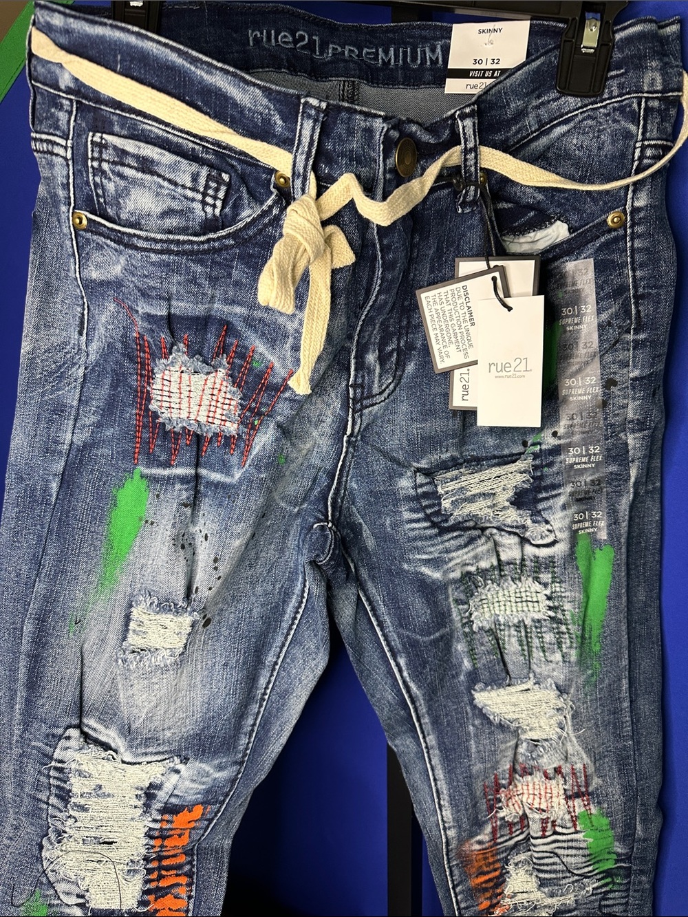 rue21 Distressed Skinny Jeans in Blue with Green Paint Accents